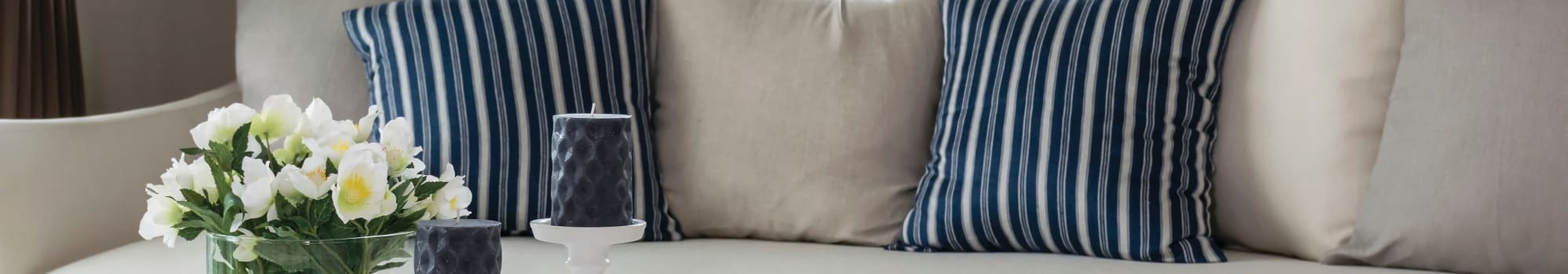 blue and white striped pillows on couch